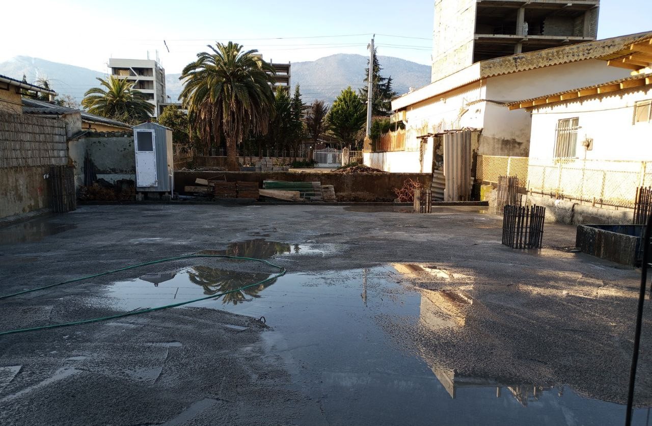 Concrete pouring for building foundation during structural construction phase