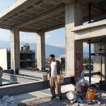 Application of waterproofing membrane on building roof surface