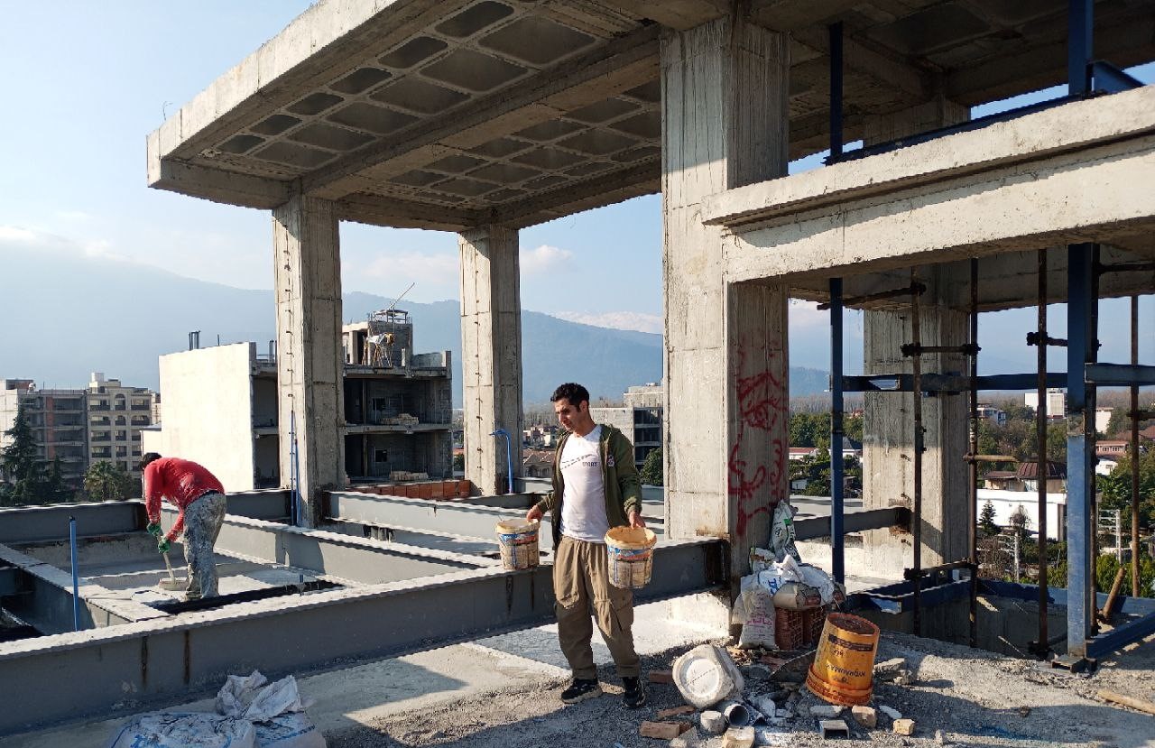 Application of waterproofing membrane on building roof surface